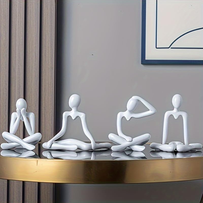 Four white abstract human figures in different poses on a reflective surface with a neutral background