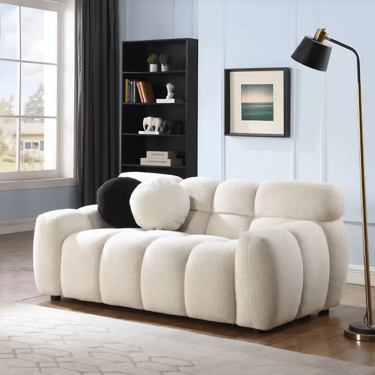 Modern living room with a beige sofa, bookshelf, and floor lamp.